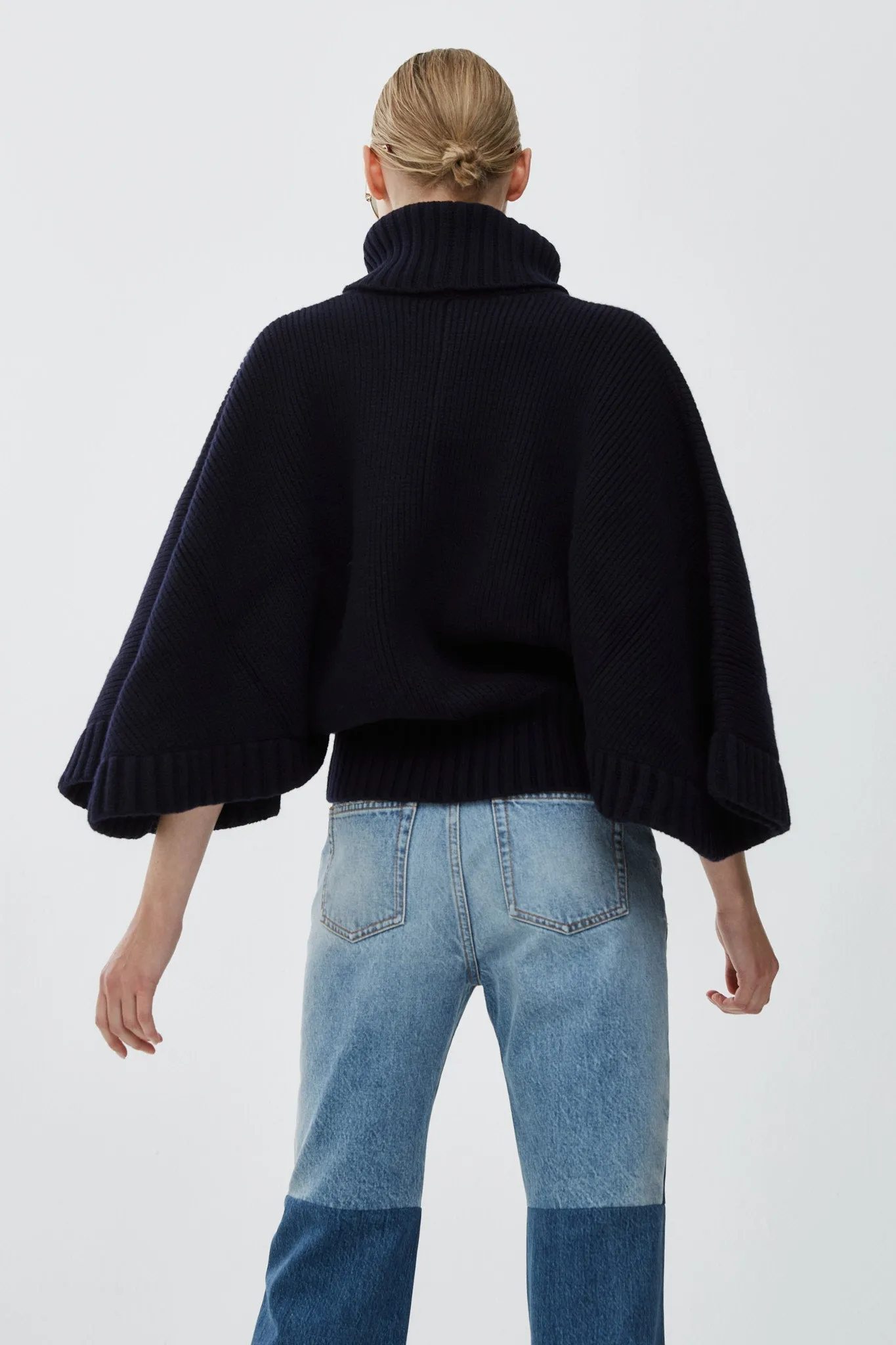 Short dark blue turtleneck cape