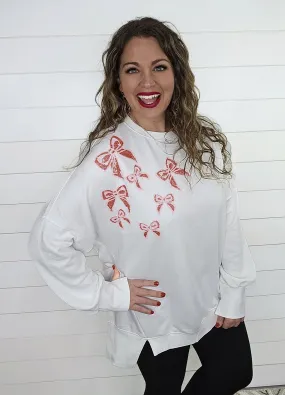 WHITE SEQUIN BOW ACCENT HI LOW PULLOVER